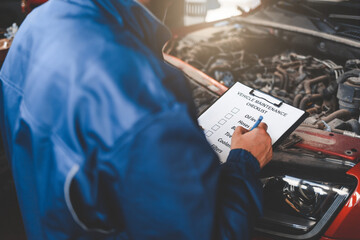 Car mechanic inspecting vehicle. 
Auto inspection concept