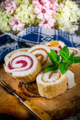 Slices of homemade sweet roll with fruit jam.