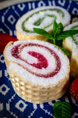 Slices of homemade sweet roll with fruit jam.