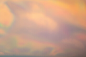 Abstract blurred holographic iridescent foil background. Trendy gradient with vivid colors