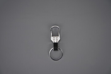 Stylish and sophisticated keychain on a grey background
