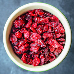 dried cherry or cranberry sweet berries harvesting Menu concept serving size. food background top view copy space for text organic healthy eating raw