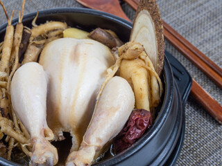 Korean food : Samgyetang(Ginseng Chicken Soup).  Samgyetang is a summer health food that is boiled with various medicinal herbs such as ginseng, jujube, glutinous rice, garlic, and chicken.