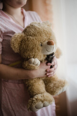 girl with teddy bear, soft toy, girl holding a soft bear 