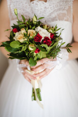 Obraz na płótnie Canvas the bride's bouquet, bride holding bouquet, wedding day, bride in wedding dress, morning bride