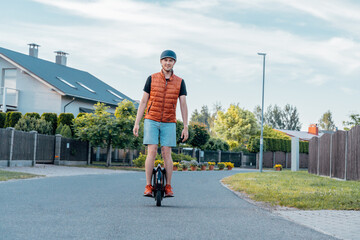 Young Man Riding On Electric Unicycle (EUC) On Street, Best Mobile Portable Personal Transportation Vehicle, Summer Day © toyechkina