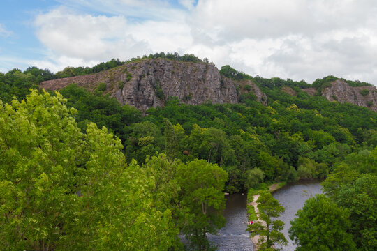 Beautiful panorama landscape. Luxurious preserved forest and cliffs. A river is passing through. Aerial view