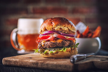 american hamburger with glass of beer in american restaurant or pub, product photography for...