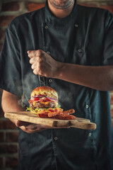 american hamburger with glass of beer in american restaurant or pub, product photography for restaurant in american style