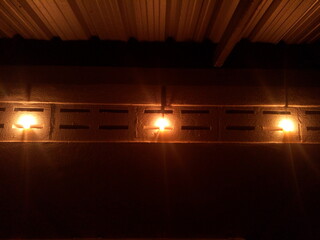 The candle light illuminated the inside of my shower room during the power outage.