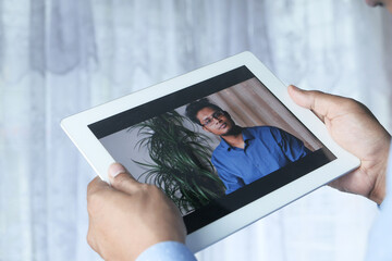 businessman working in video conference, close up.