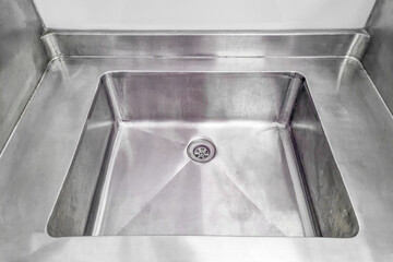 Stainless steel sink. Angle view of kitchen sink. Stainless steel sink for wash dishes and vegetables on kitchen.