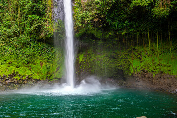 La Fortuna Waterfall in a forest, close to Arenal Volcano, Costa Rica national park. Central America..