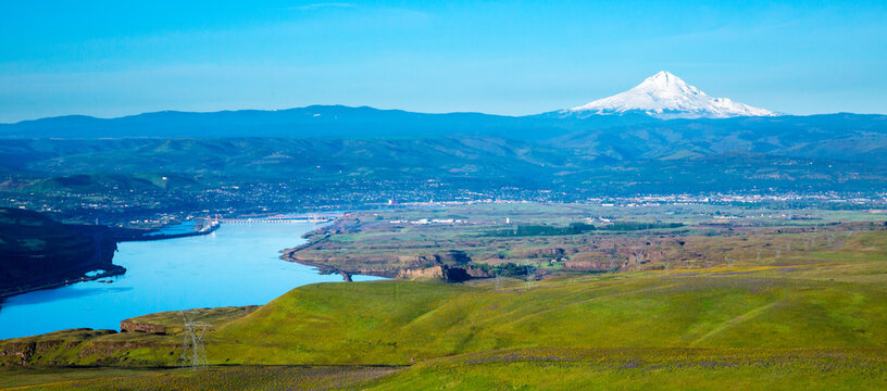 The rolling hills of Columbia Hills State Park, Washington, the Columbia River, City of The Dalles, Oregon and Mt Hood in backgrould.