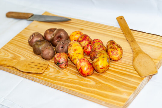 regional potatoes from the Andes at a market in Peru, Bolivia, Argentina, south america on a wooden table. Selective focus