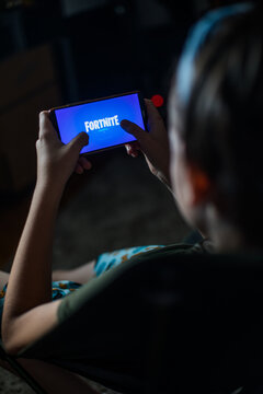 Child playing Fortnite on a mobile phone