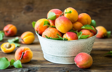 Fresh organic apricots on the wooden table