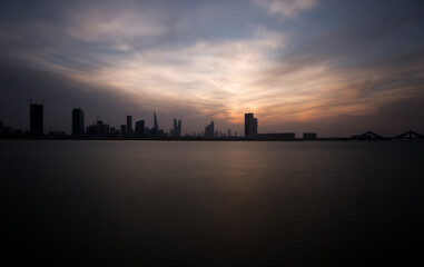 Bahrain skyline at dusk with dramatic cloud