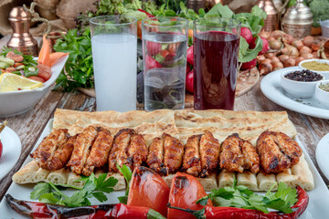 Turkish cuisine chicken wings grill. Heap fried on a grill of chicken wings with sauce and spice...