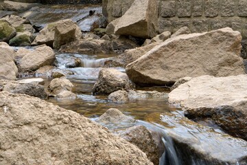 Naklejka na ściany i meble Flowing river in spring
