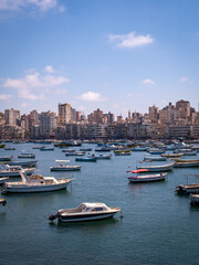 Fototapeta na wymiar Boats and skyline in Alexandria