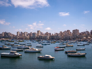 Fototapeta na wymiar Boats and the skyline of colonial Alexandria