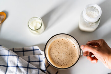 Holding a cup of coffee 