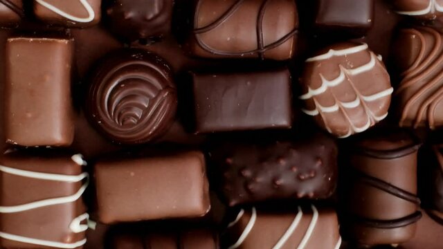 chocolate candy set. Box of chocolates close-up .assorted chocolate sweets.Chocolate candies set in an open box. top view. sweet dessert.