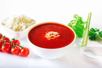 Tomato soup with rice. Healthy food. White background.