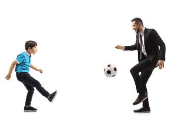 Father and son playing footbal