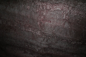 A cave with stalactites and stalagmites in an underground cave, rocks.