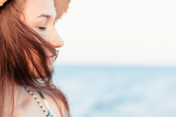 Portrait of a Ukrainian young woman with a sensual, pensive, dreaming face and hair developing in...