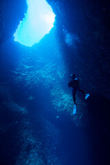 scuba diver and blue hole