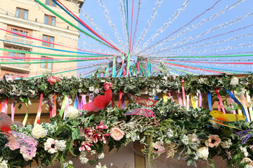 "To you, darlings" Festival in Moscow devoted International Women's Day 2020. 8 march. Holiday decor with flowers, garlands, flags, tapes at Manezhnaya Square, Moscow city, Russia. Street decoration