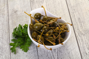Fototapeta premium Pickled Capersberries in the bowl