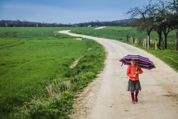 young woman walking in the countryside