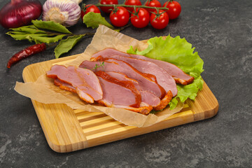 Sliced smoked duck breast served salad