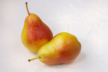 Two pears on a white table