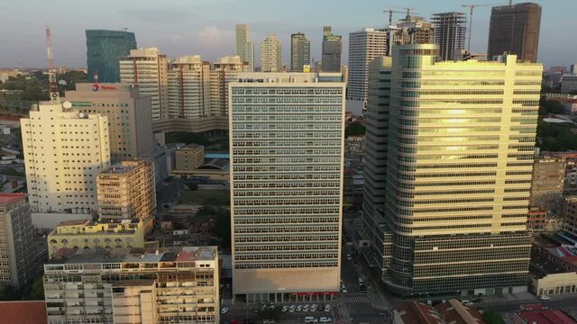 Luanda skyline from above, capital of Angola. Aerial footage, pan out during the sunset hour