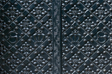 Heavy metal door decorated with black