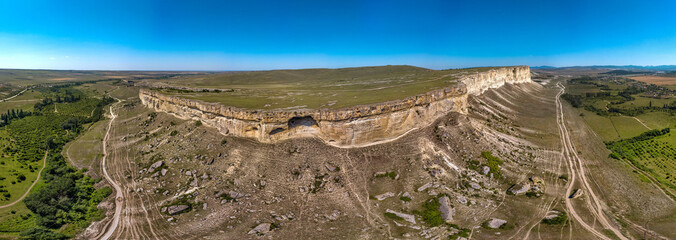 Belaya Skala near the city of Belogorsk in Crimea (South of Russia) - a popular tourist destination on a summer cloudless day - a wide panoramic drone view