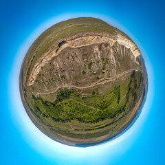 Belaya Skala near the city of Belogorsk in Crimea (South of Russia) - a popular tourist destination on a summer cloudless day - a top panoramic drone view of a small planet