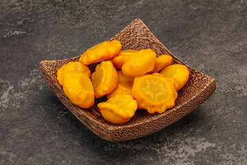Marinated yellow patisson in the bowl