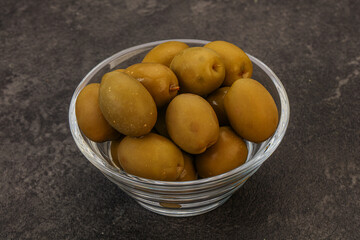 Green pickled olives in the bowl
