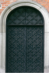 Heavy metal door decorated with black