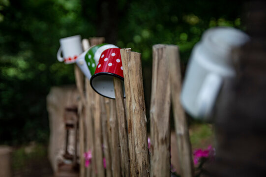 Colorful pots on the fence