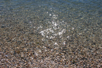 The bottom of the river with small colored stones