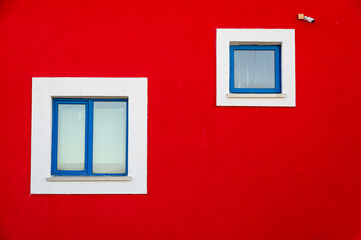 white windows on red wall
