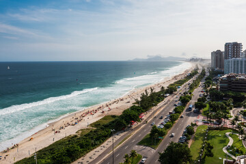 Aerial view of Copacana beach from a near building. Sunny and colorful day. Clean sea with a lot of people at the beach