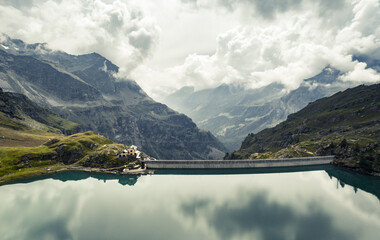 Panoramic view of man made dam in alpine mountains